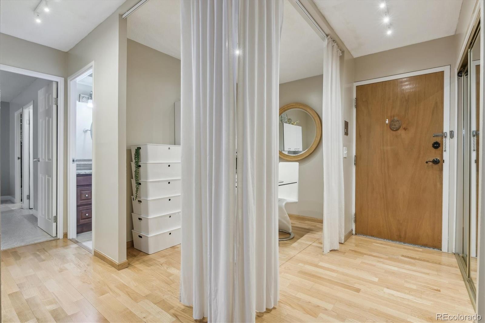 9655 Center Avenue, Unit 5A Denver, CO 80247 - Photo 8 of 45 wooden floor and closet in a room
