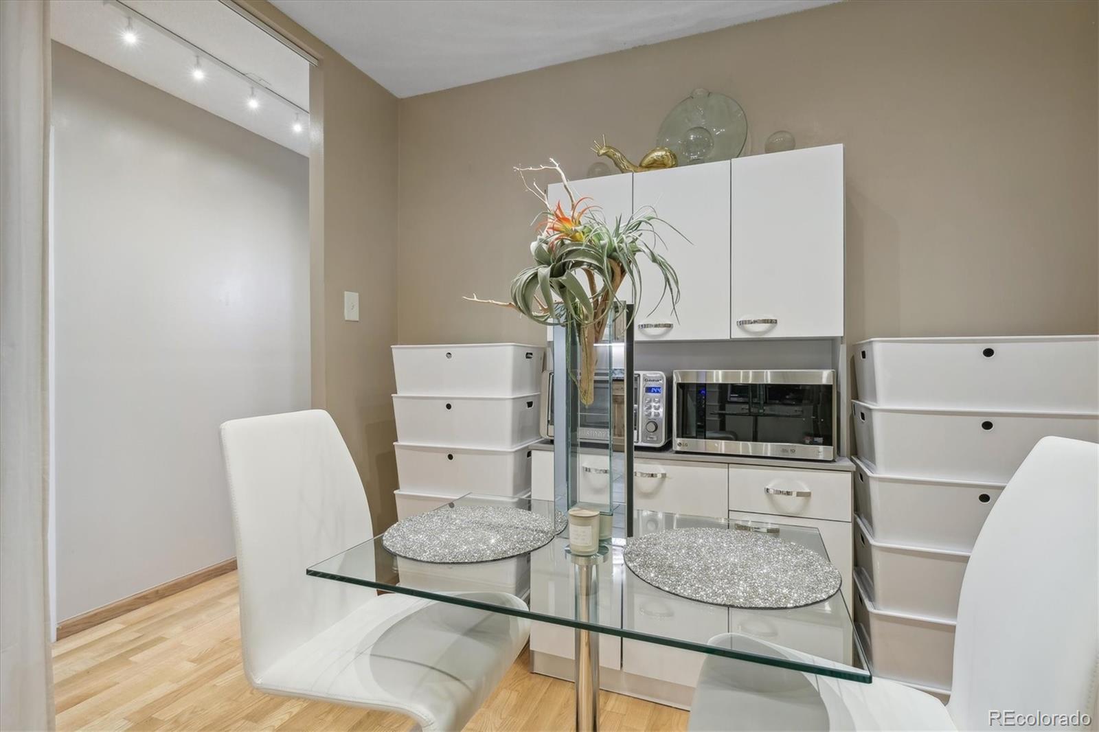 9655 Center Avenue, Unit 5A Denver, CO 80247 - Photo 9 of 45 a living room with furniture and a table