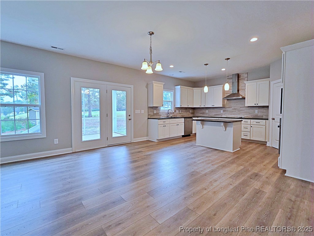 425 Shawcroft Road Fayetteville, NC 28311 - Photo 11 of 50 a view of kitchen with granite countertop stainless steel appliances and wooden floor