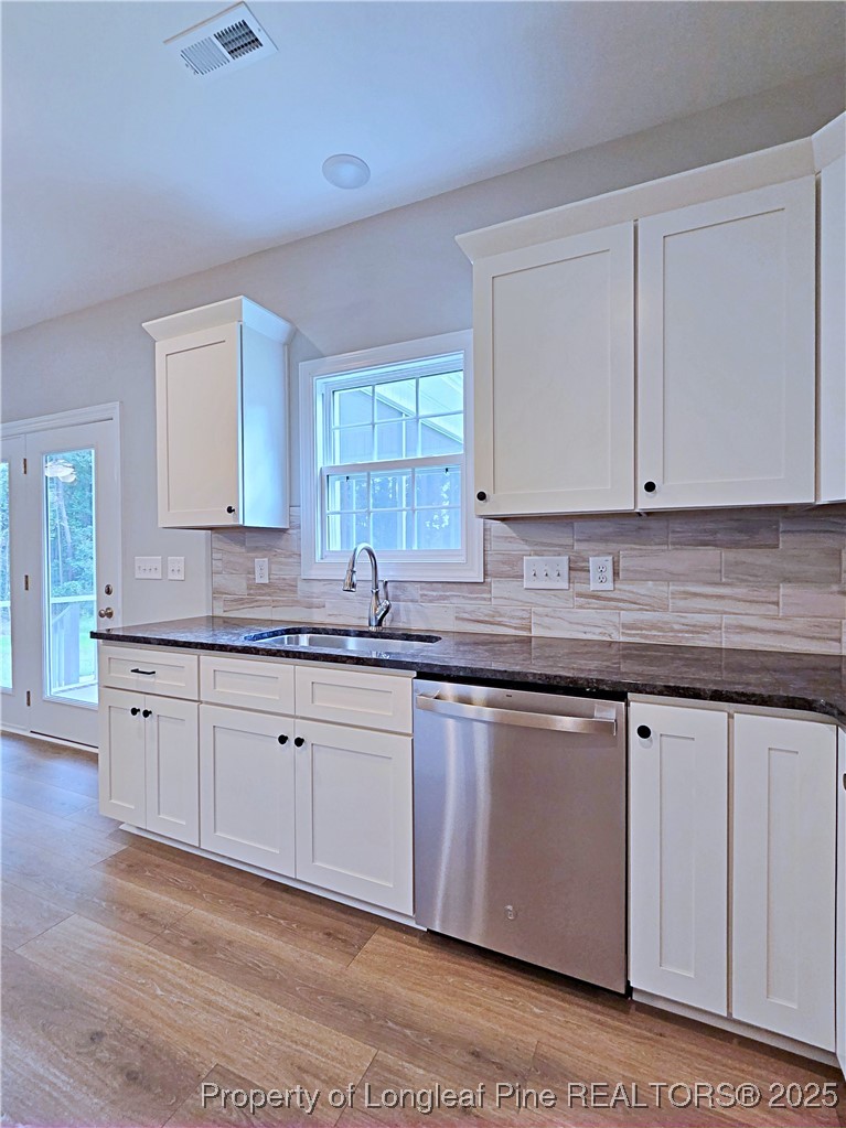 425 Shawcroft Road Fayetteville, NC 28311 - Photo 14 of 50 a kitchen with granite countertop white cabinets and sink