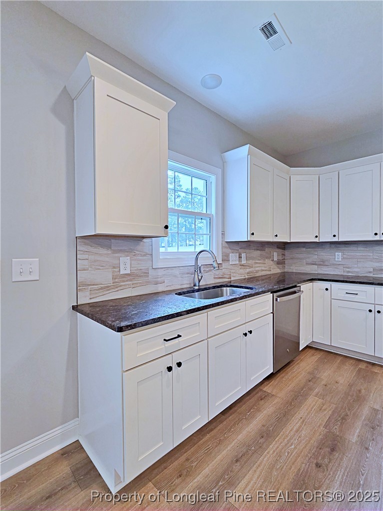425 Shawcroft Road Fayetteville, NC 28311 - Photo 15 of 50 a kitchen with granite countertop a sink and cabinets