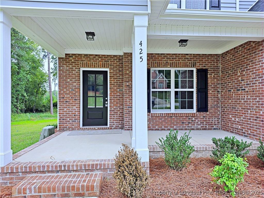 425 Shawcroft Road Fayetteville, NC 28311 - Photo 2 of 50 a front view of a house with a garden