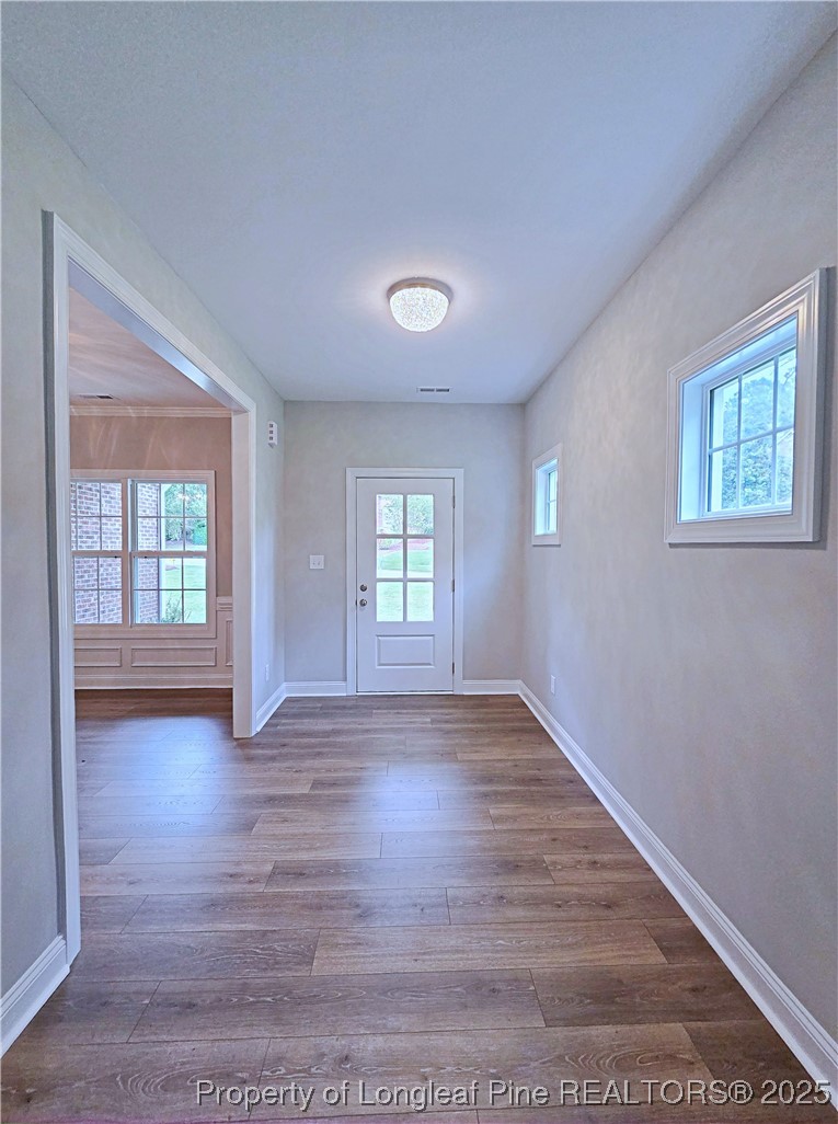 425 Shawcroft Road Fayetteville, NC 28311 - Photo 3 of 50 an empty room with wooden floor and windows
