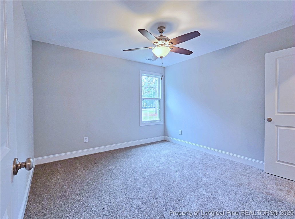 425 Shawcroft Road Fayetteville, NC 28311 - Photo 36 of 50 a view of an empty room with a window