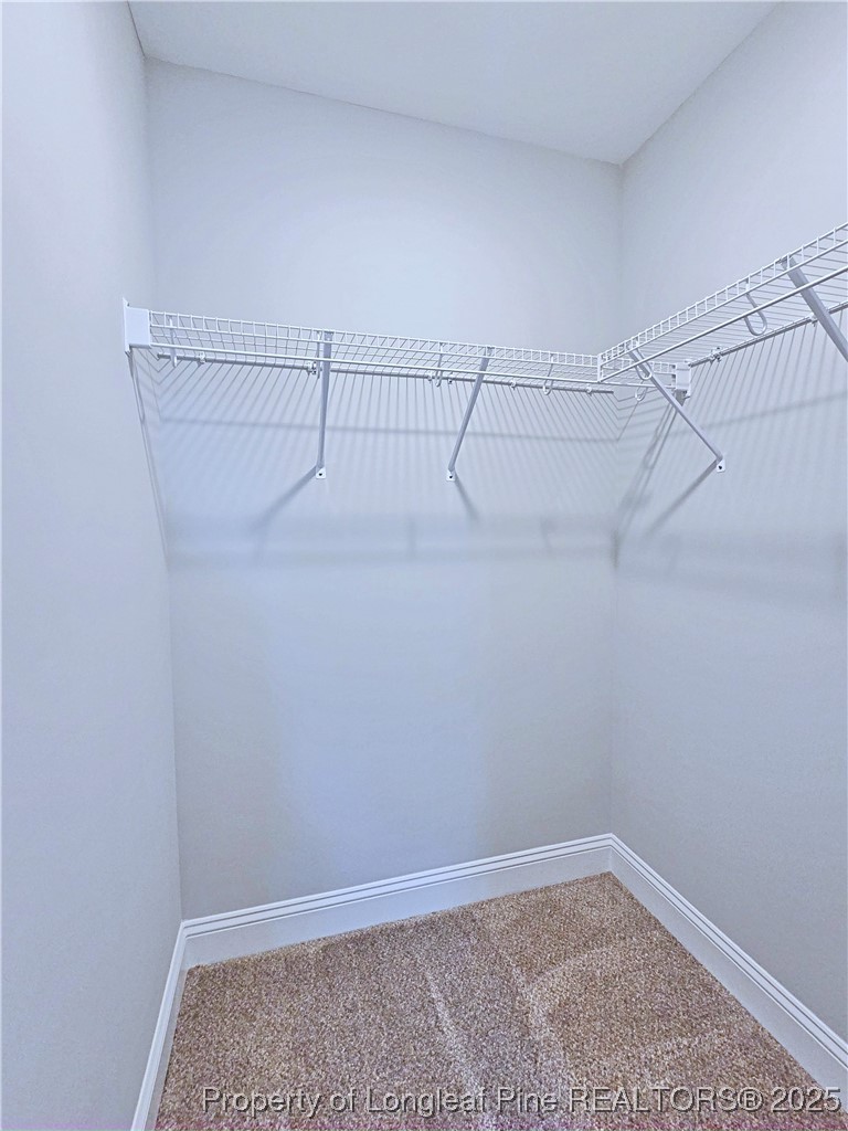 425 Shawcroft Road Fayetteville, NC 28311 - Photo 38 of 50 a view of a room with racks on the wall