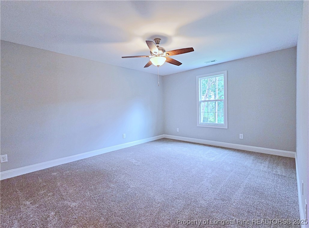 425 Shawcroft Road Fayetteville, NC 28311 - Photo 42 of 50 a view of an empty room with a window