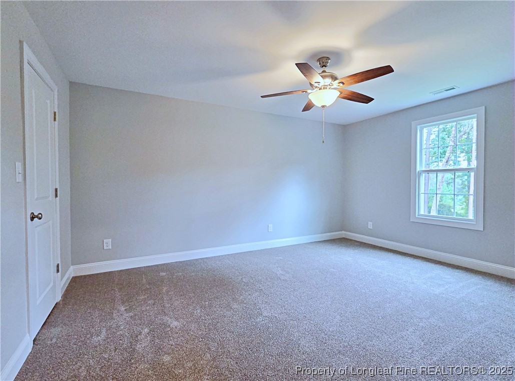 425 Shawcroft Road Fayetteville, NC 28311 - Photo 43 of 50 a view of an empty room with a window