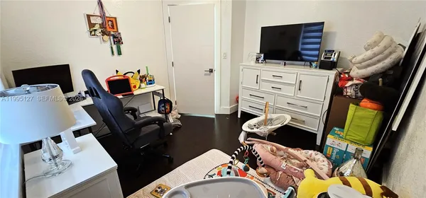 a bedroom with a workspace