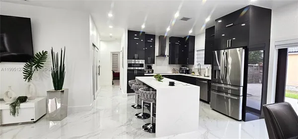 a kitchen with a refrigerator and a sink
