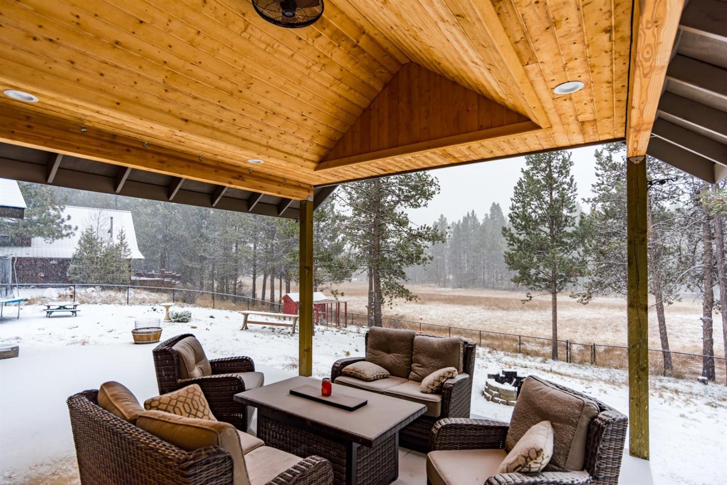 17325 Elsinore Road Bend, OR 97707 - Photo 24 of 25 Large covered porch and backyard looking