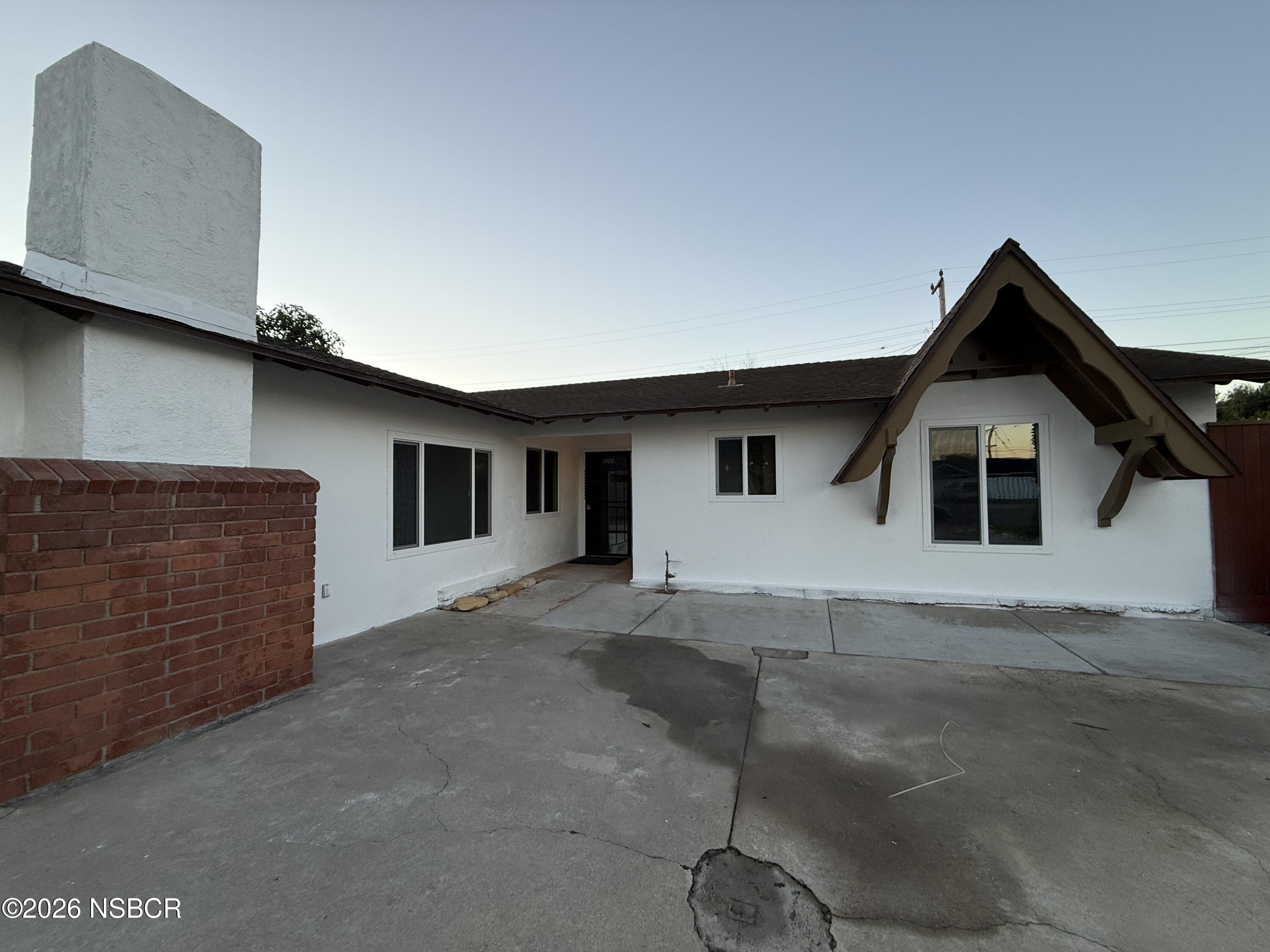 1408 West Walnut Avenue Lompoc, CA 93436 - Photo 2 of 27 a view of a house with a patio