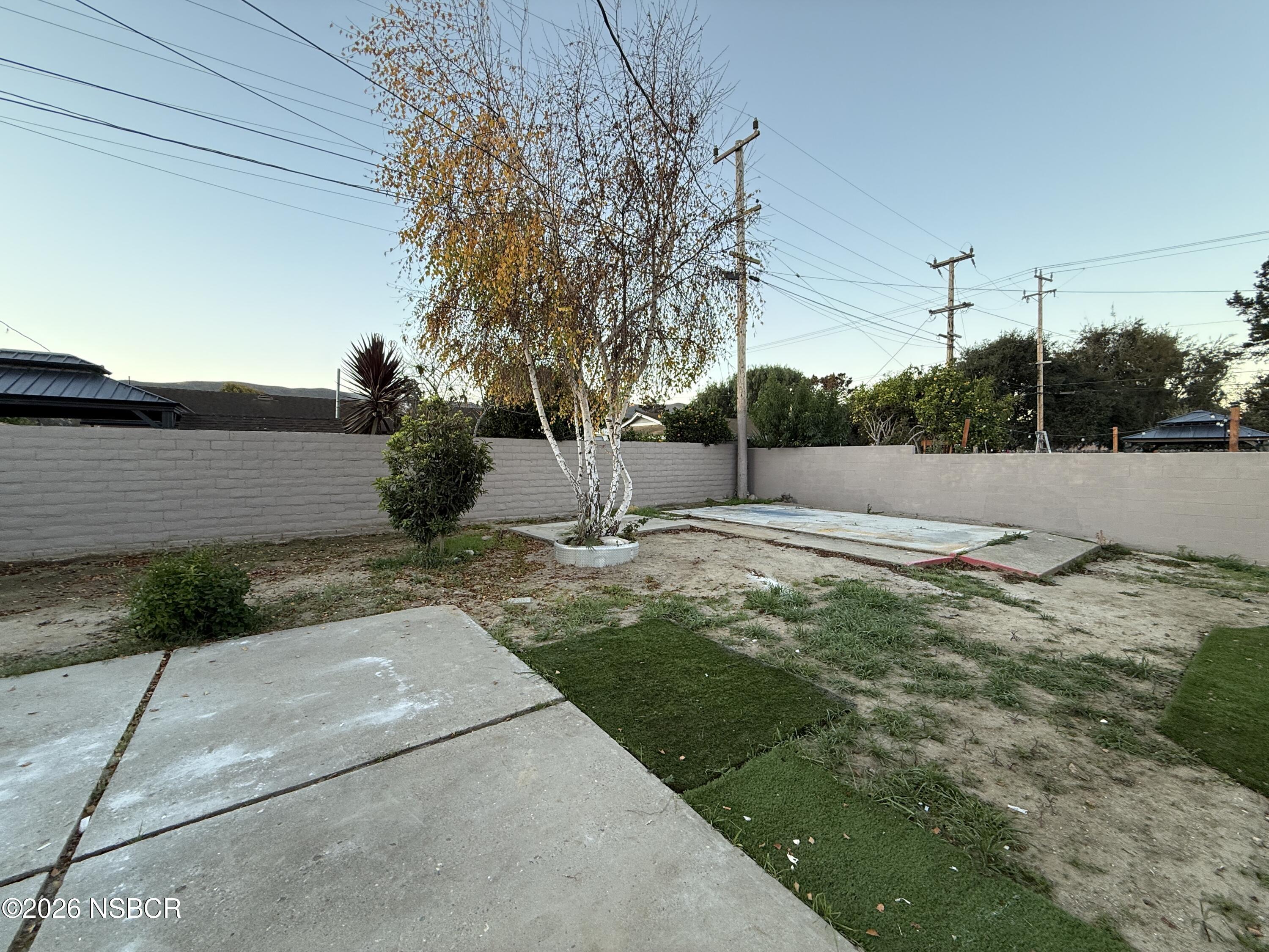 1408 West Walnut Avenue Lompoc, CA 93436 - Photo 22 of 27 a view of backyard with green space