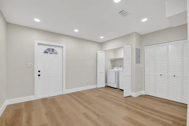 a view of a livingroom with wooden floor