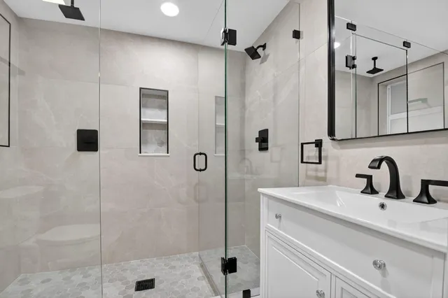 a bathroom with a sink and mirror