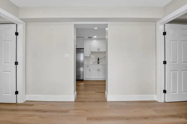 a view of a kitchen cabinets and wooden floor