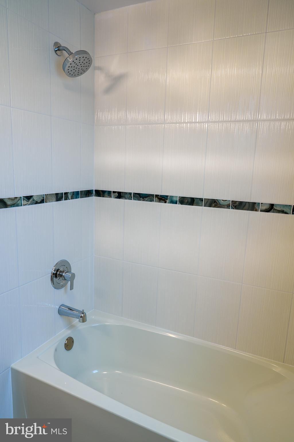 9939 Medway Road Philadelphia, PA 19115 - Photo 37 of 43 a bathroom with a shower and a bath tub