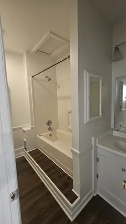 a kitchen with a refrigerator sink and cabinets