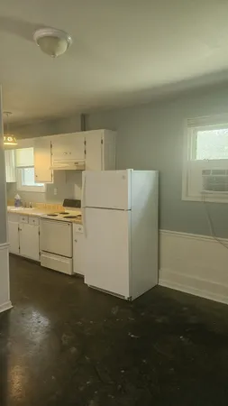 a view of a storage & utility room with a sink
