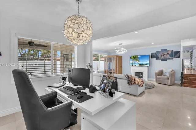 a view of a livingroom with furniture and a chandelier