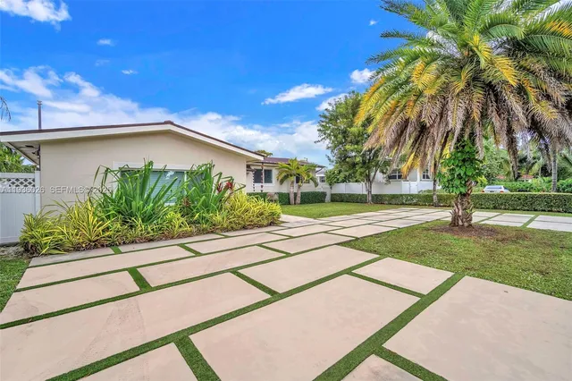 a house with a yard and a garden
