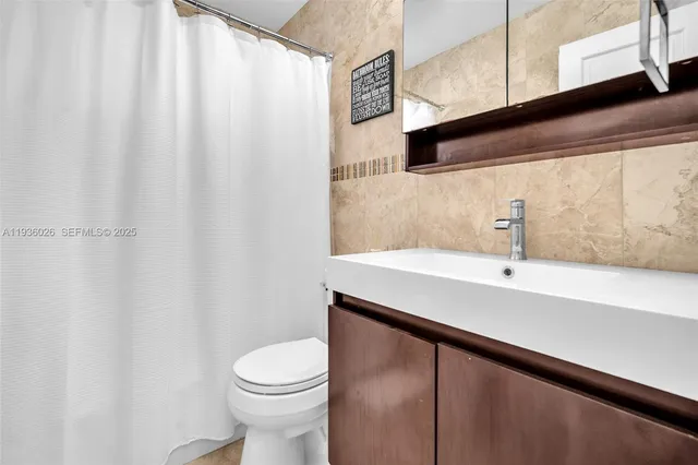 a bathroom with a sink and a toilet