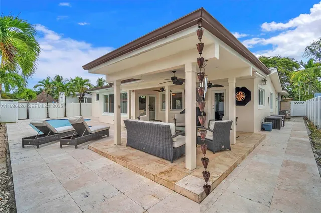a view of swimming pool with outdoor seating