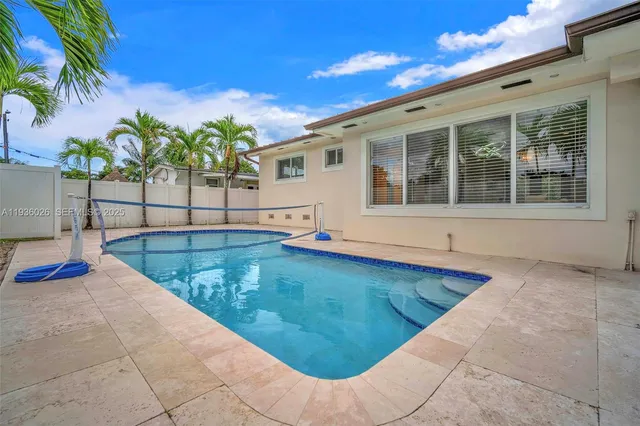a view of a house with swimming pool