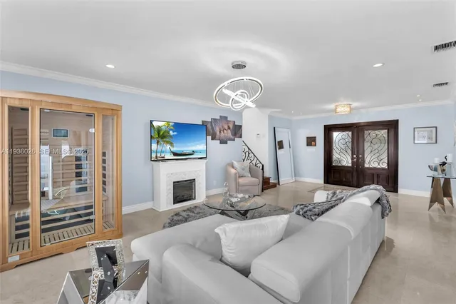 a living room with furniture a fireplace and a flat screen tv