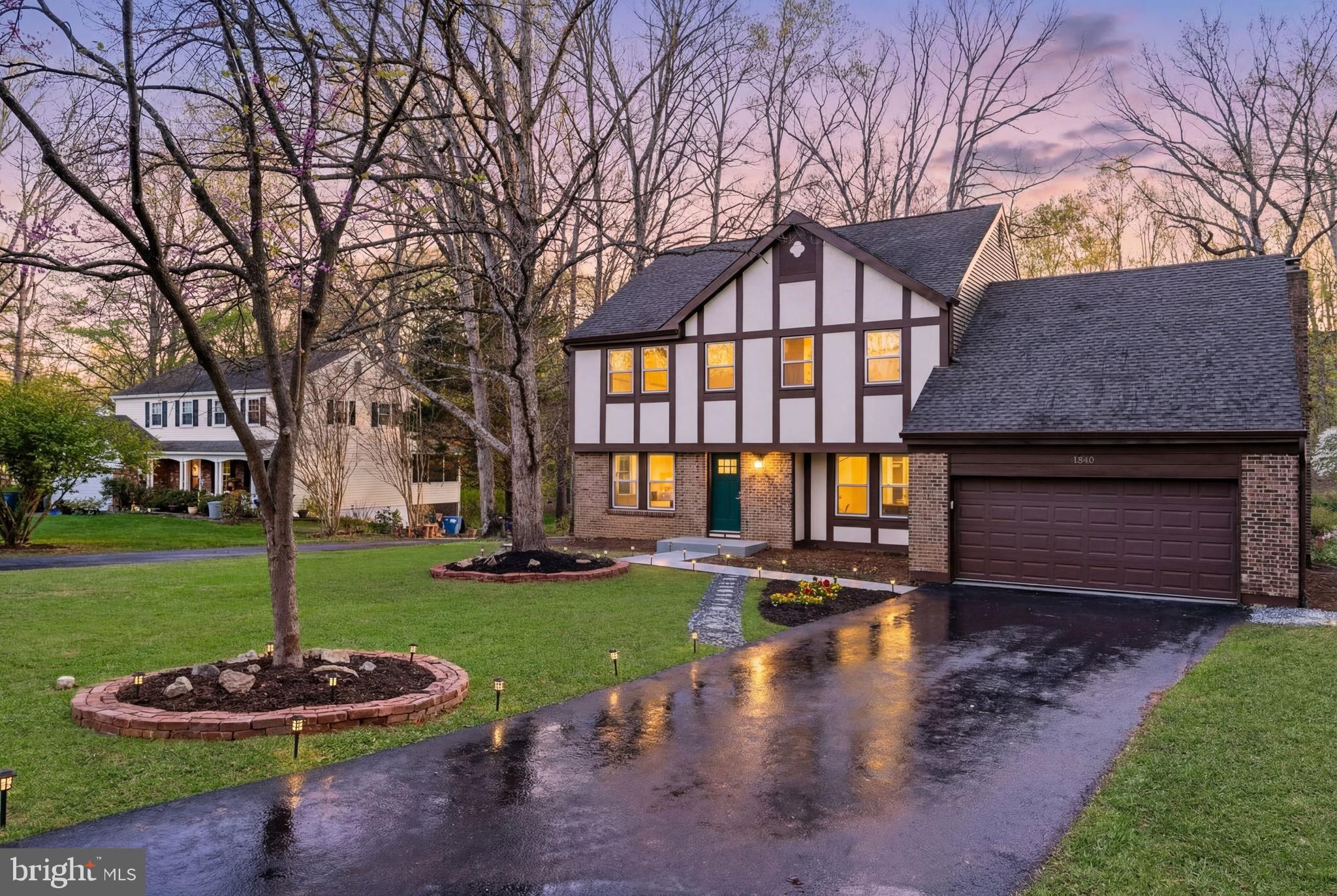 1840 Post Oak Trail Reston, VA 20191 - Photo 1 of 46 a front view of a house with a yard
