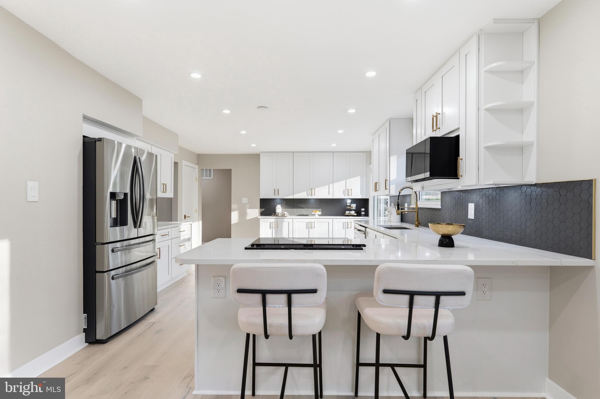 1840 Post Oak Trail Reston, VA 20191 - Photo 14 of 46 a kitchen with refrigerator and cabinets