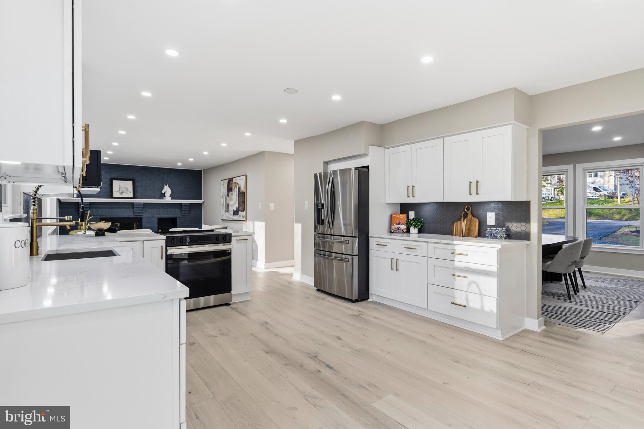 1840 Post Oak Trail Reston, VA 20191 - Photo 16 of 47 a kitchen with stainless steel appliances a refrigerator stove microwave and cabinets