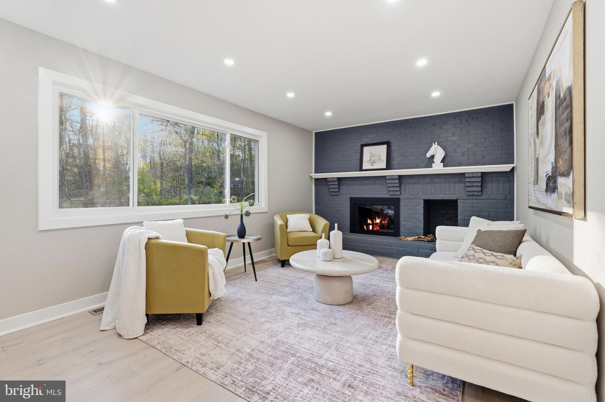 1840 Post Oak Trail Reston, VA 20191 - Photo 18 of 46 a living room with furniture and a fireplace