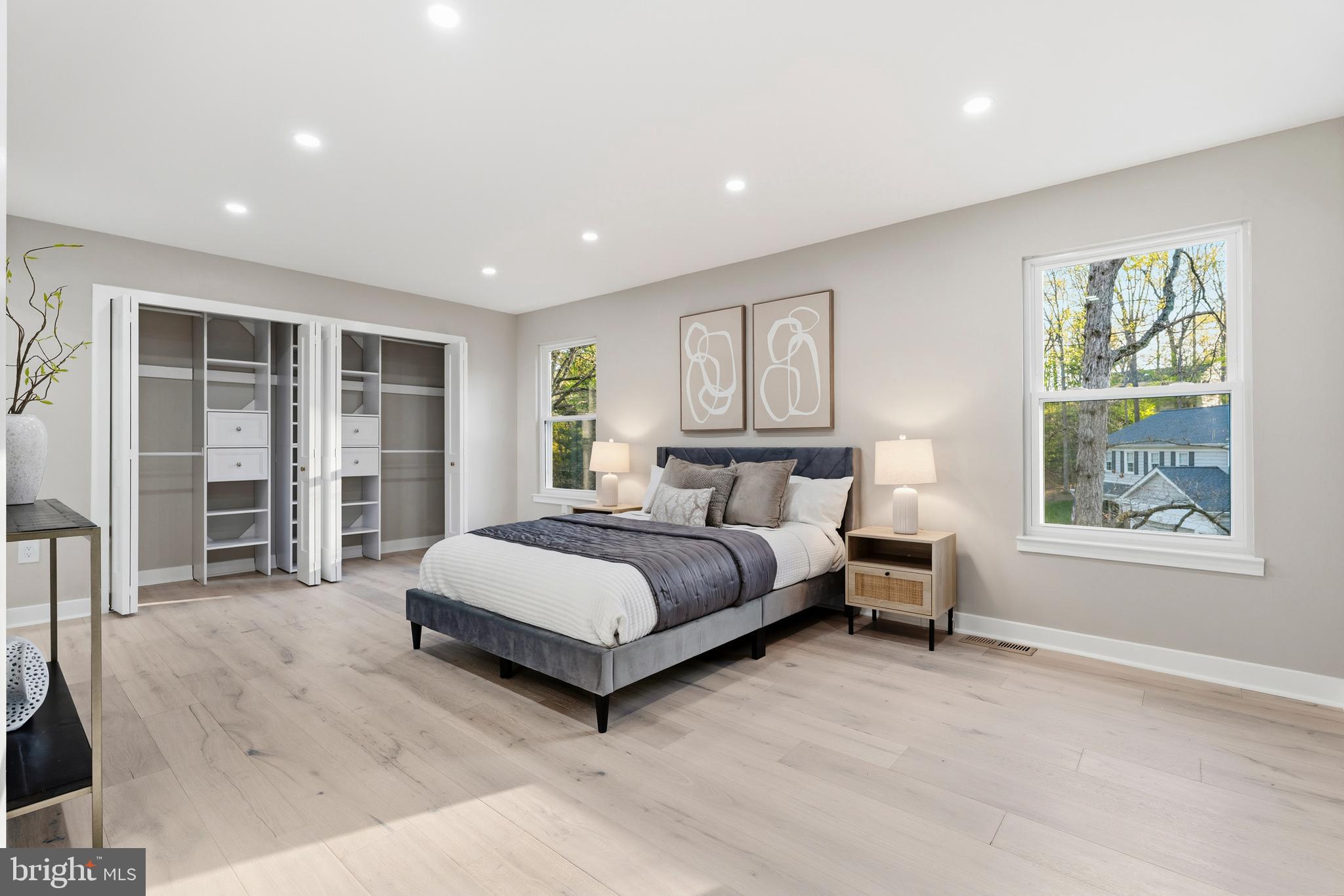 1840 Post Oak Trail Reston, VA 20191 - Photo 22 of 46 a spacious bedroom with a large bed and a window