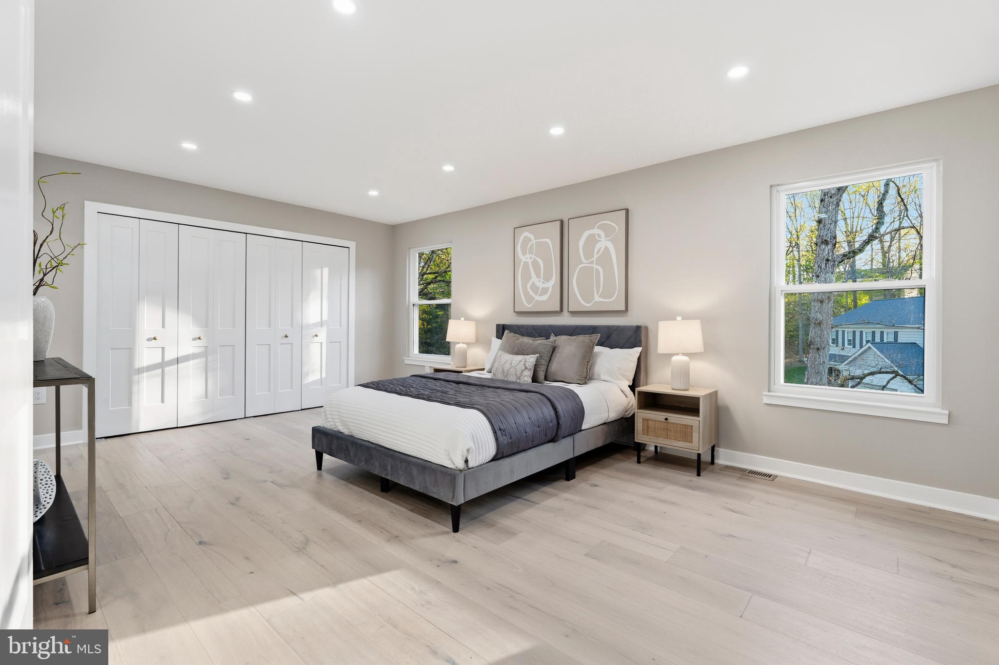 1840 Post Oak Trail Reston, VA 20191 - Photo 23 of 46 a spacious bedroom with a large bed and a window