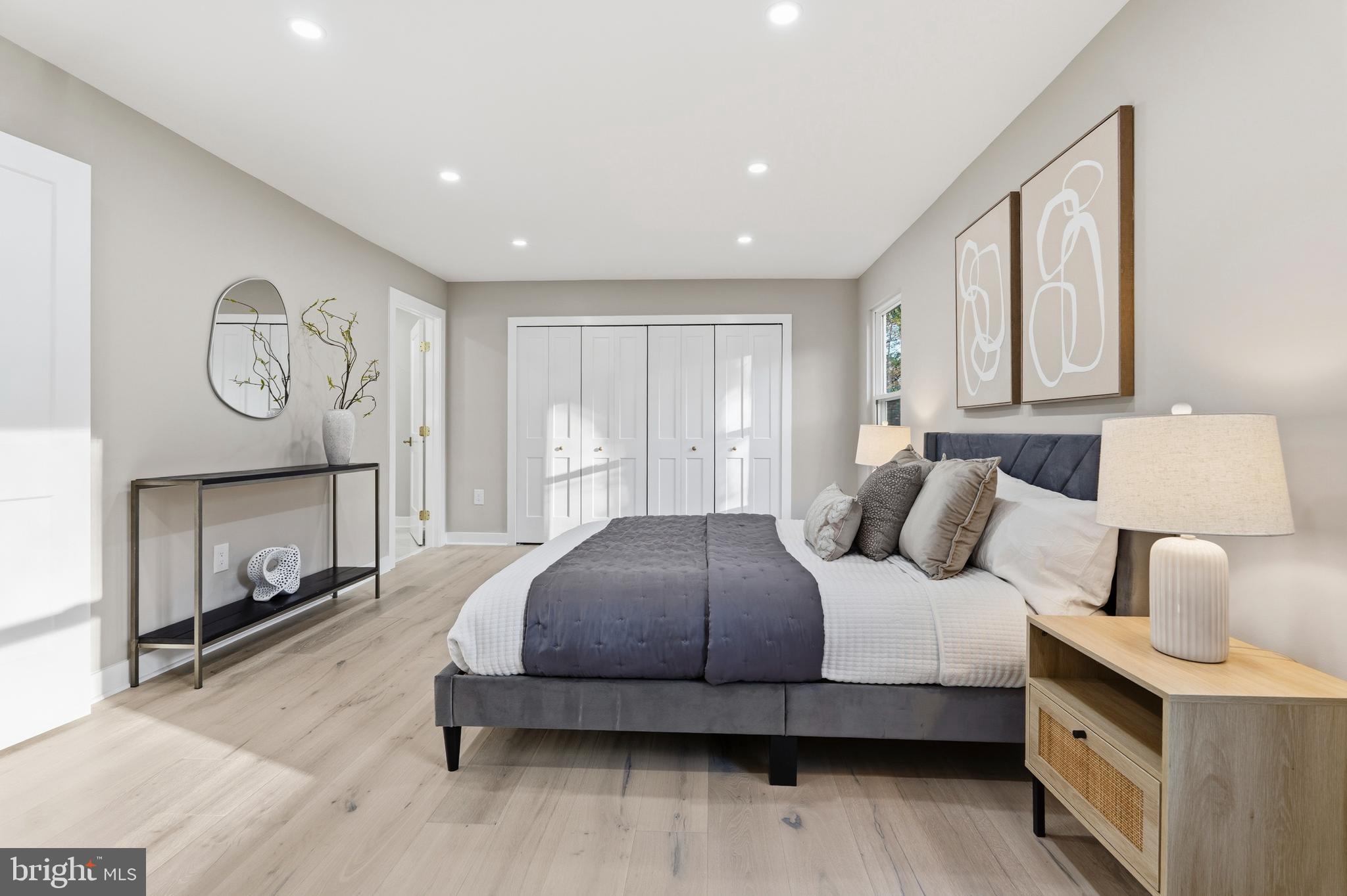 1840 Post Oak Trail Reston, VA 20191 - Photo 25 of 47 a bedroom with a bed a mirror and a window