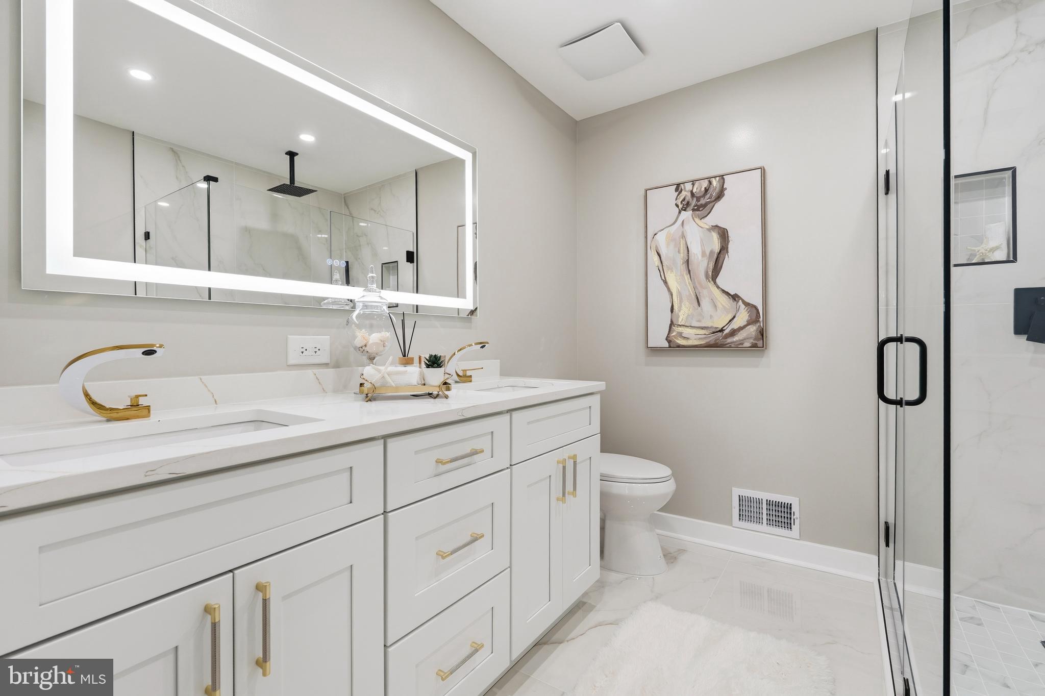 1840 Post Oak Trail Reston, VA 20191 - Photo 26 of 46 a bathroom with a granite countertop sink mirror and toilet