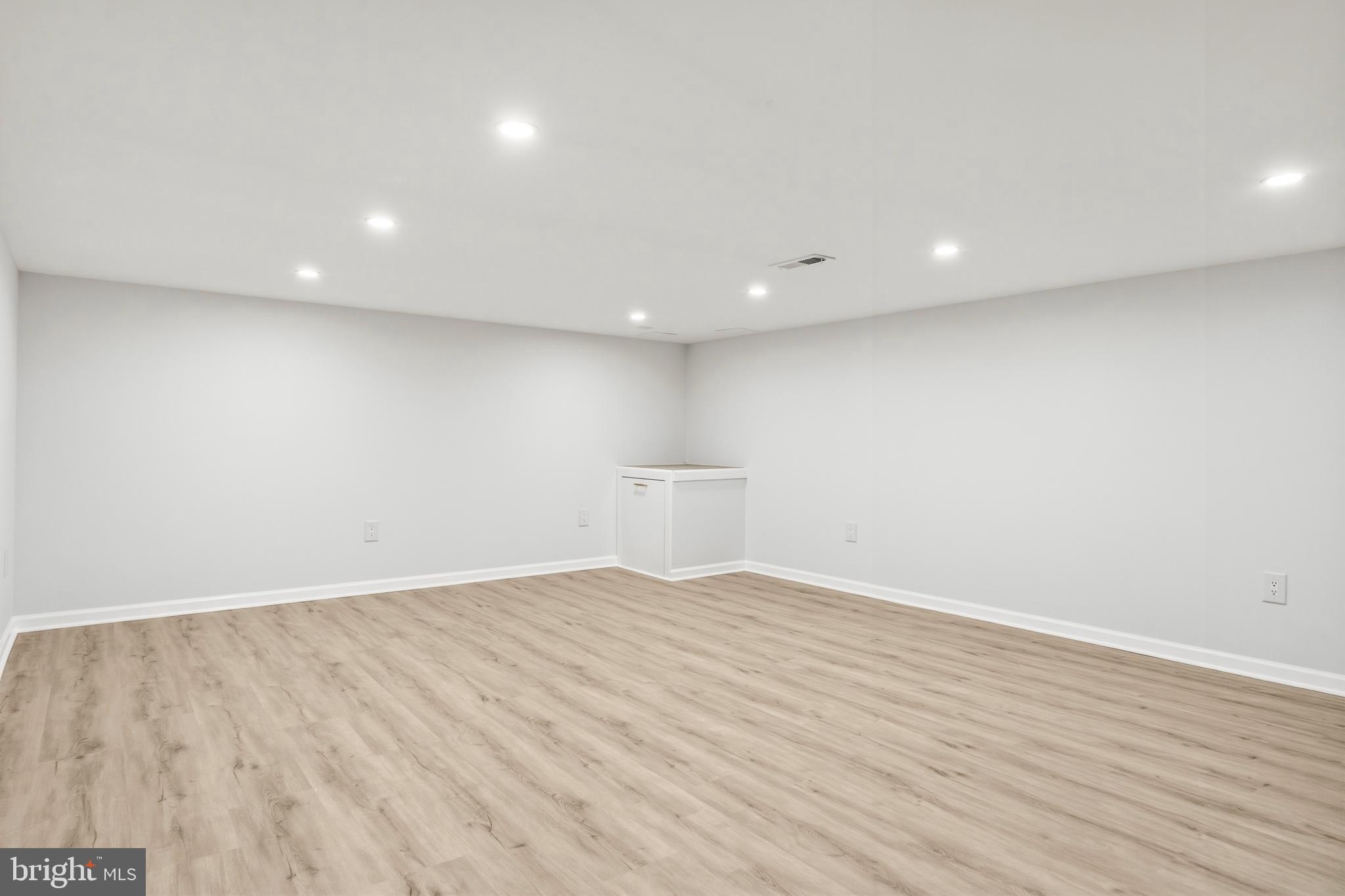 1840 Post Oak Trail Reston, VA 20191 - Photo 41 of 46 a view of empty room with wooden floor and fan