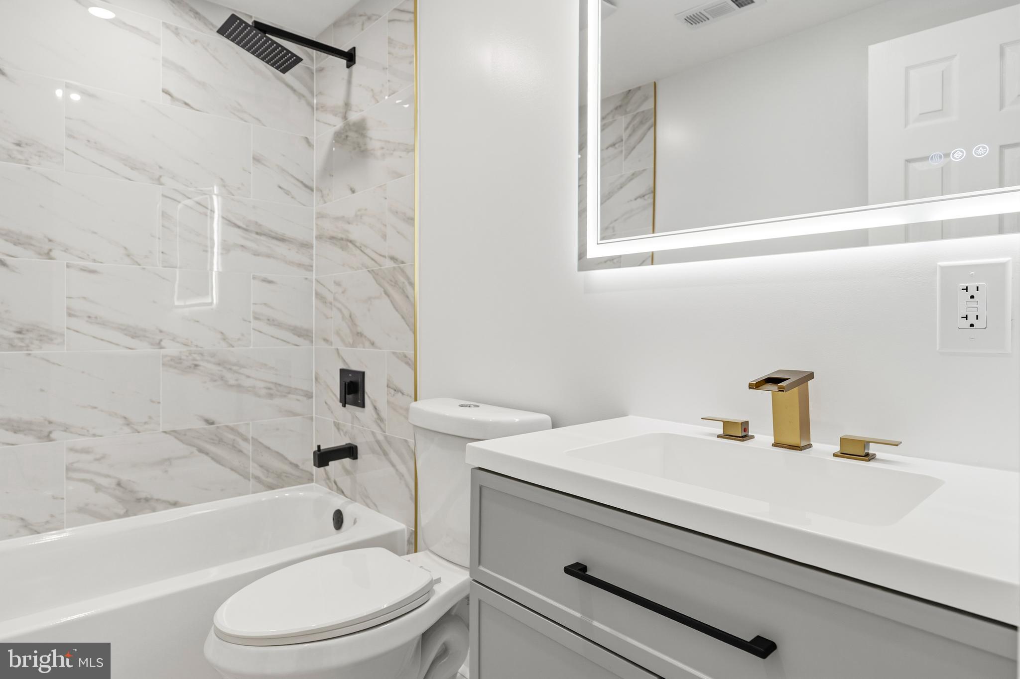 1840 Post Oak Trail Reston, VA 20191 - Photo 42 of 46 a bathroom with a sink a toilet and a bathtub
