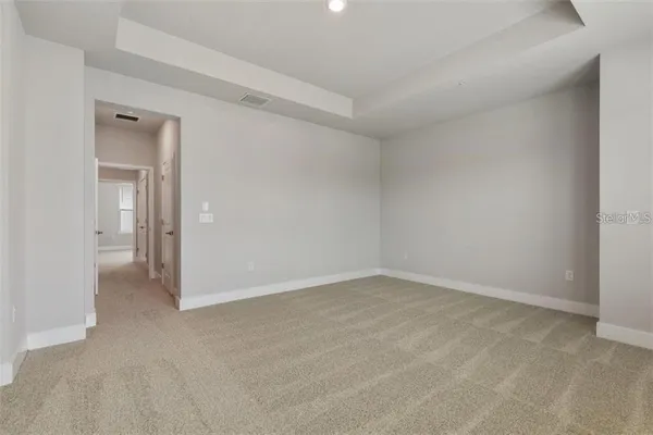 a bathroom with double vanity sinks and a mirror