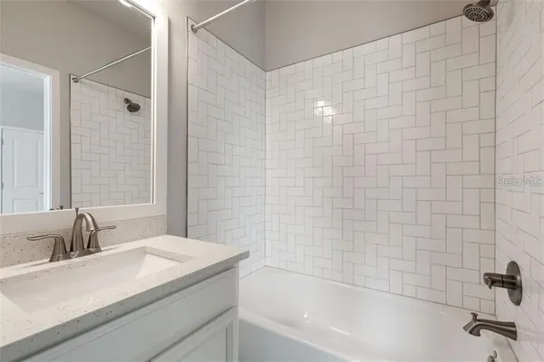 a view of empty room with white walls and white walls