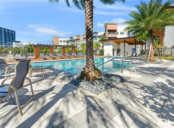 a view of a lake with couches and city view
