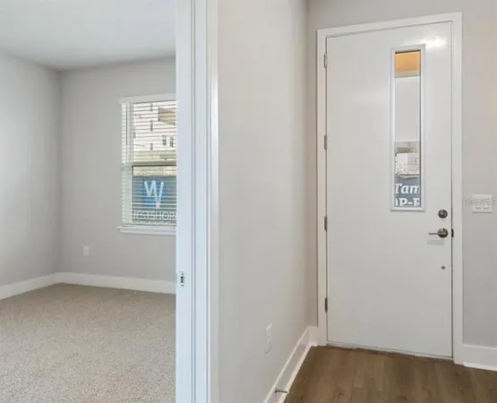 a view of entryway with wooden floor