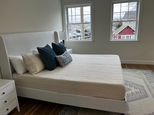 1 Pleasant Street, Unit 204 Cohasset, MA 02025 - Photo 14 of 20 a bedroom with bed and window