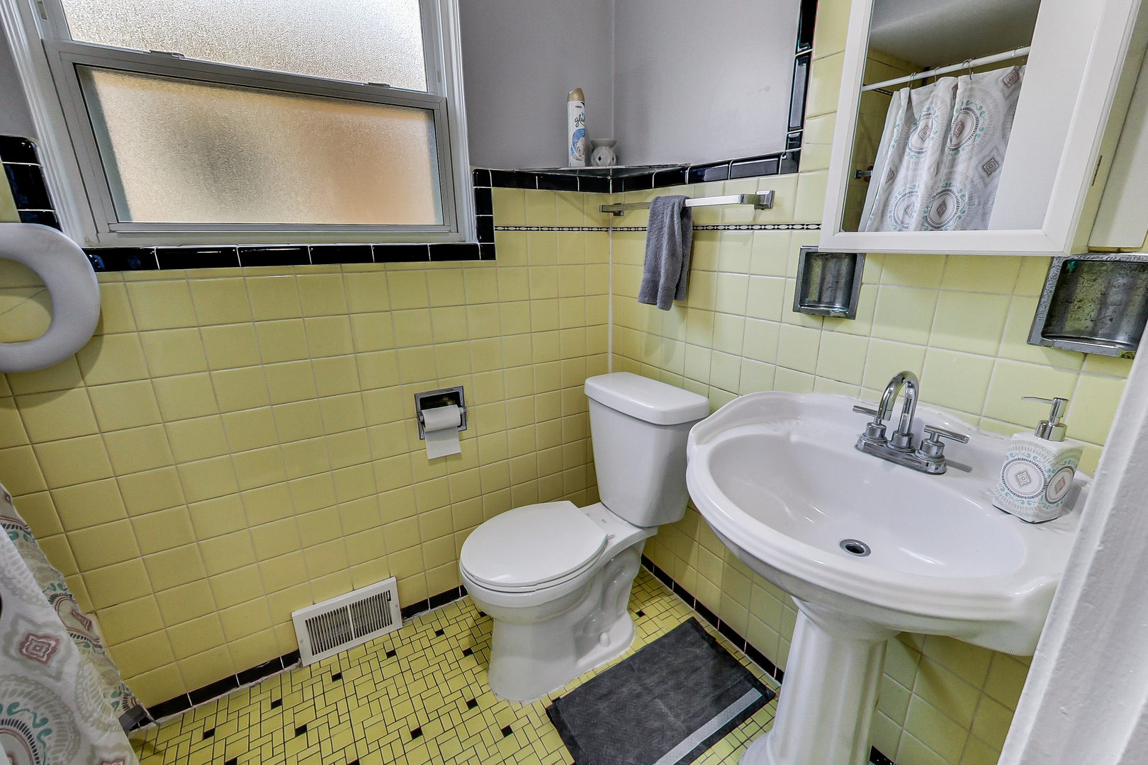 Undisclosed Address Chicago, IL 60625 - Photo 13 of 30 a bathroom with a sink toilet and mirror