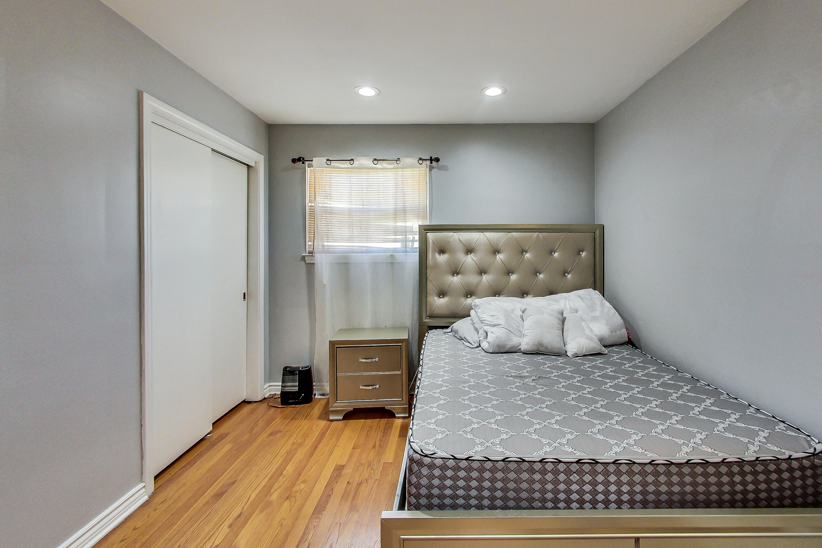 Undisclosed Address Chicago, IL 60625 - Photo 15 of 30 a bedroom with a large bed and a window