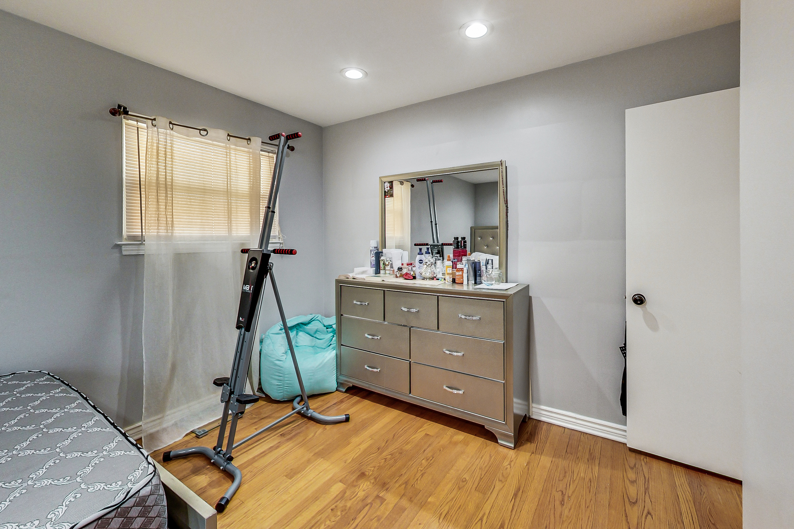 Undisclosed Address Chicago, IL 60625 - Photo 16 of 30 a bedroom with a bed and a mirror