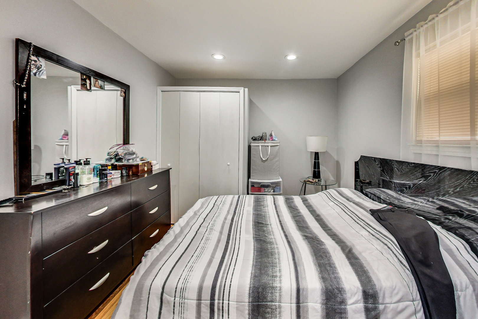 Undisclosed Address Chicago, IL 60625 - Photo 18 of 30 a bedroom with a bed and a dresser