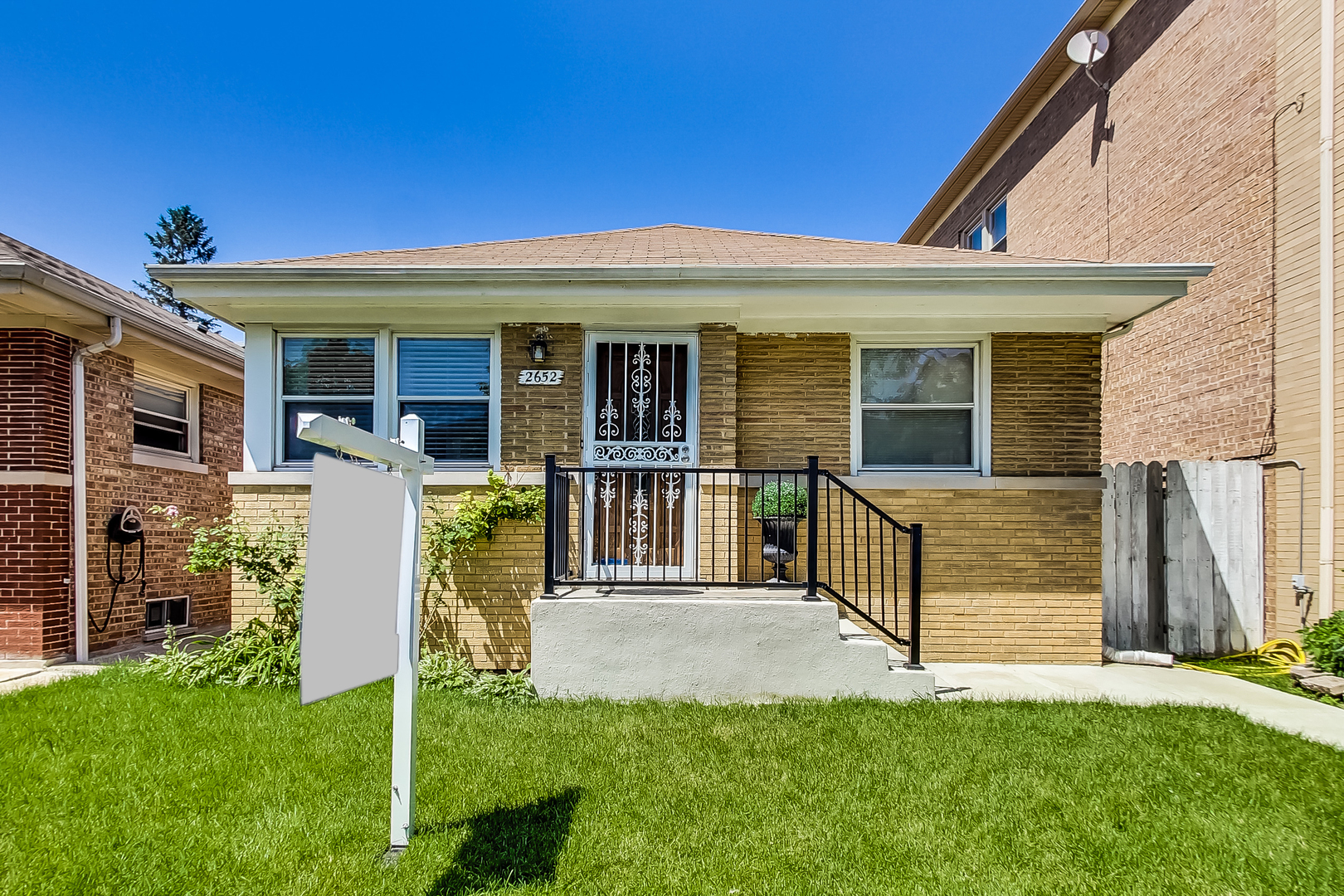 Undisclosed Address Chicago, IL 60625 - Photo 2 of 30 front view of a house with a yard