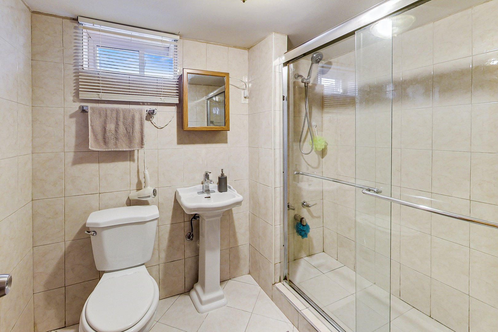 Undisclosed Address Chicago, IL 60625 - Photo 26 of 30 a bathroom with a toilet sink and shower