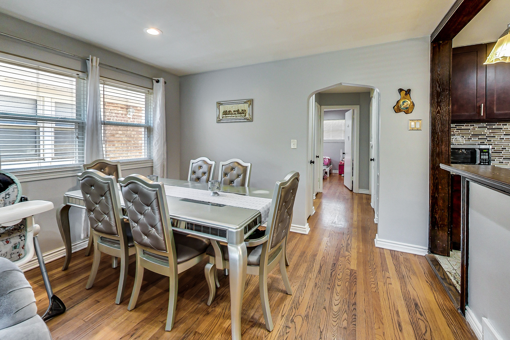 Undisclosed Address Chicago, IL 60625 - Photo 7 of 30 a view of a dining room with furniture window and wooden floor